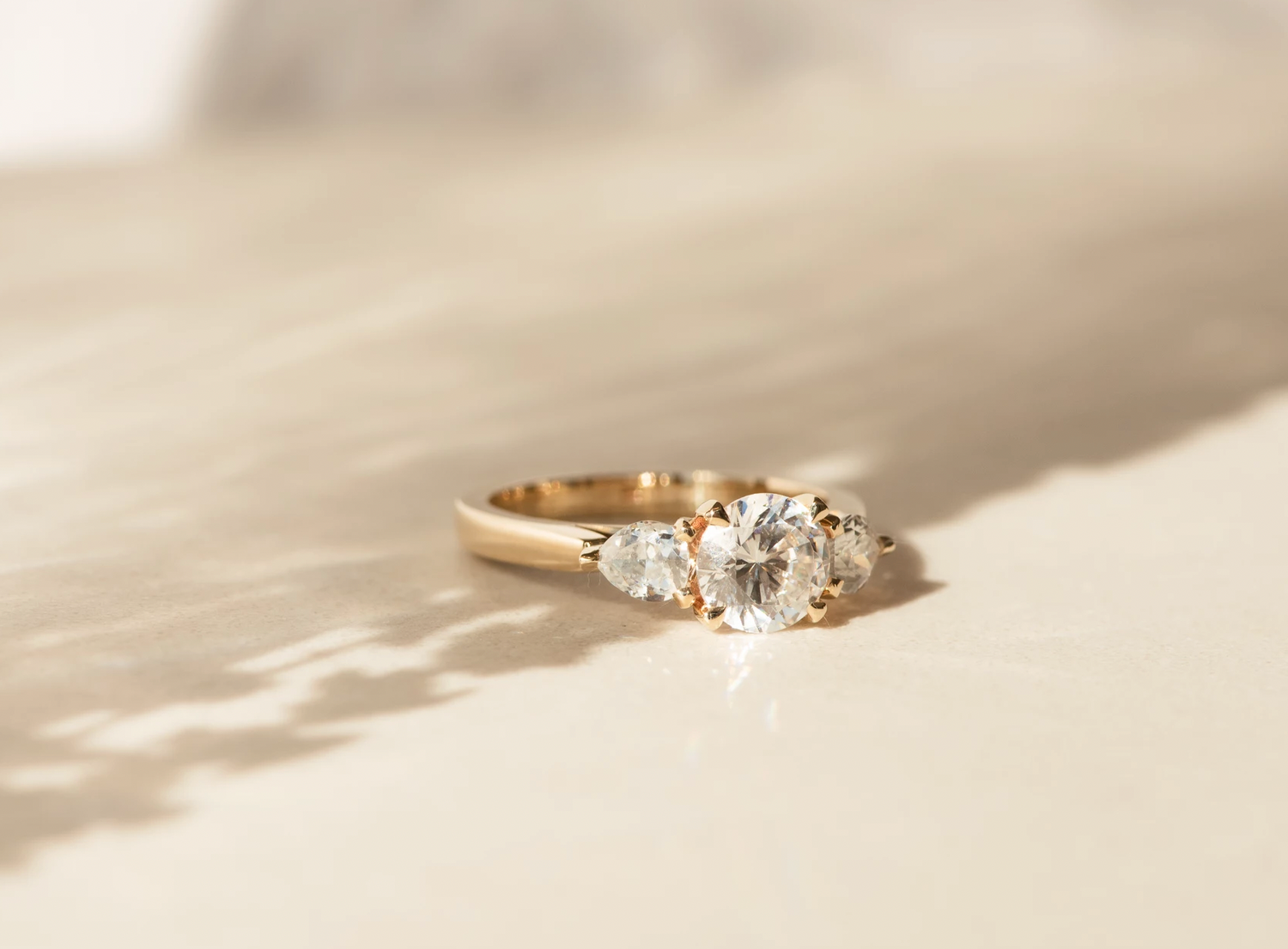 Grande Trois Round Brilliant Cut Diamond Engagement Ring Three Stone with Pear Diamond Side Stones -  Dean & Dust - Bespoke Design
