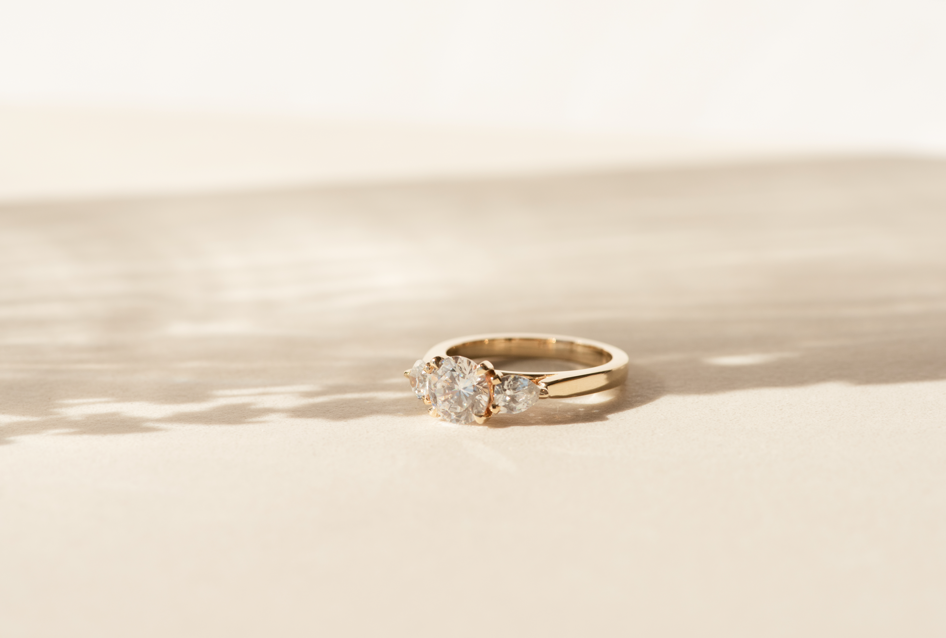 Grande Trois Round Brilliant Cut Diamond Engagement Ring Three Stone with Pear Diamond Side Stones -  Dean & Dust - Bespoke Design