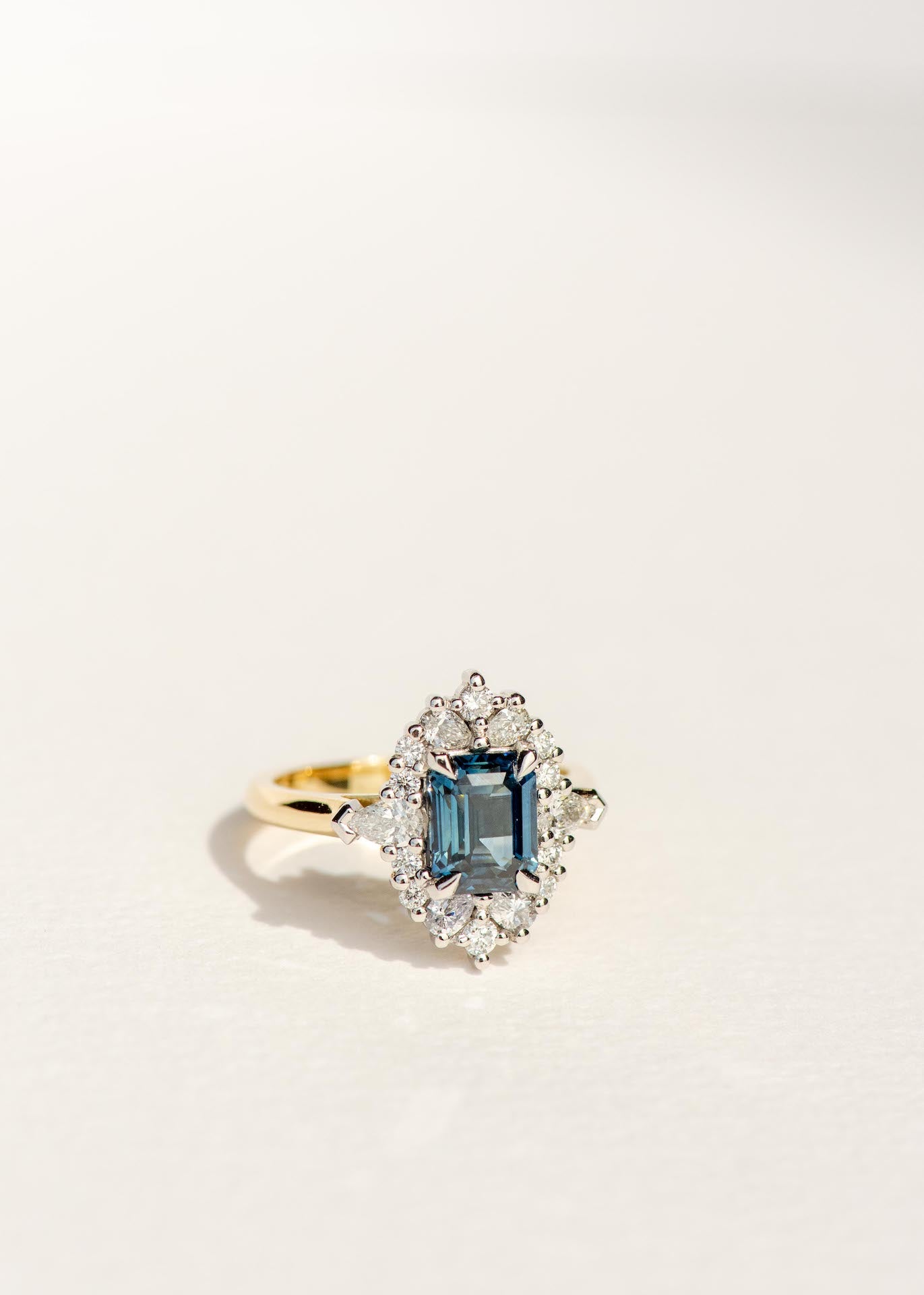 Dean & Dust - Bespoke Design - Teal Sapphire Engagement Ring with Diamond Halo - Four Claw - White & Yellow Gold Setting