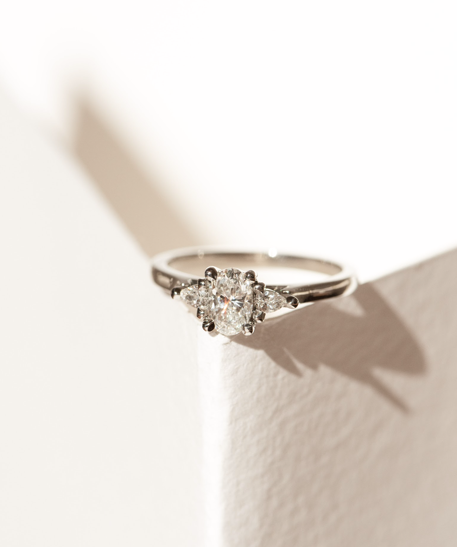 Dean & Dust - Bespoke Design - Three Stone Engagement Ring with Oval centre stone and Pear Diamond Side Stones