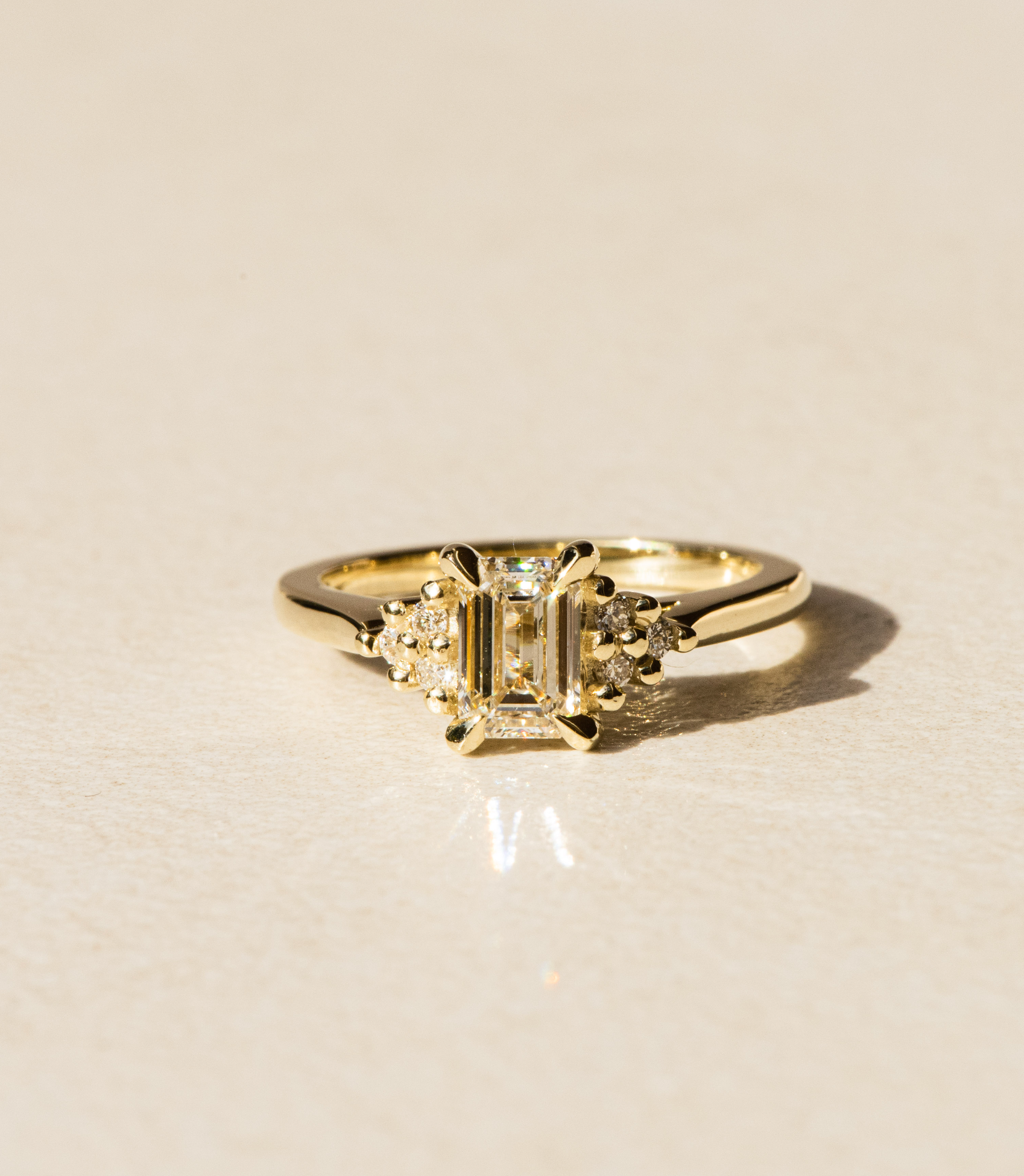 Dean & Dust - Bespoke Design - Emerald Diamond Engagement Ring with Round Diamond Side Stones